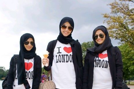 Photo credit: Peter Dench; Description: 16-year-old Salma Mohammed, centre, is one Saudi Arabian who likes to visit the Serpentine lake in Hyde Park.When the world arrives at London's 2012 Olympics site, one of the first buildings visitors will see is the Aquatics Centre - a beautiful structure designed by one of London's most illustrious Arab citizens.  Zaha Hadid, born in Baghdad, is renowned as the greatest architect to emerge from the Middle East since the Ottoman mosque builder Sinan - and is adept at building bridges that are both physical and metaphorical.  Hadid's canvas is global. Residents of Abu Dhabi using the new Sheikh Zayed Bridge can see her remarkable design skills every day, and she is behind the performing arts centre being built on Saadiyat Island. But she is also one of the architects of a deeper bridge of understanding between Arab nations and the rest of the world.  Hadid is one of more than 300,000 Arabs who live in London, with more than half a million across the UK. Numbers are boosted in the summer months by up to a million and a half visitors from the Middle East, mainly the Gulf. For many, the city's cosmopolitan appeal is the magnet.  "London is fantastic. There is nowhere like it in the world," says Sulayman Al Bassam, a British-Kuwaiti theatre director and playwright. "It is everything and anything to anyone."  Al Bassam, whose trilogy of plays inspired by Shakespeare is nearing completion, has lived and worked in the UK for almost two decades. His production of Richard III was the first Arabic-language production staged by the Royal Shakespeare Company.  Building cultural bridges is at the heart of Shubbak - the name means "window" in Arabic - the capital's first celebration of contemporary Arab culture. The three-week festival is showcasing the work of more than 100 creative figures at 30 venues across the city.